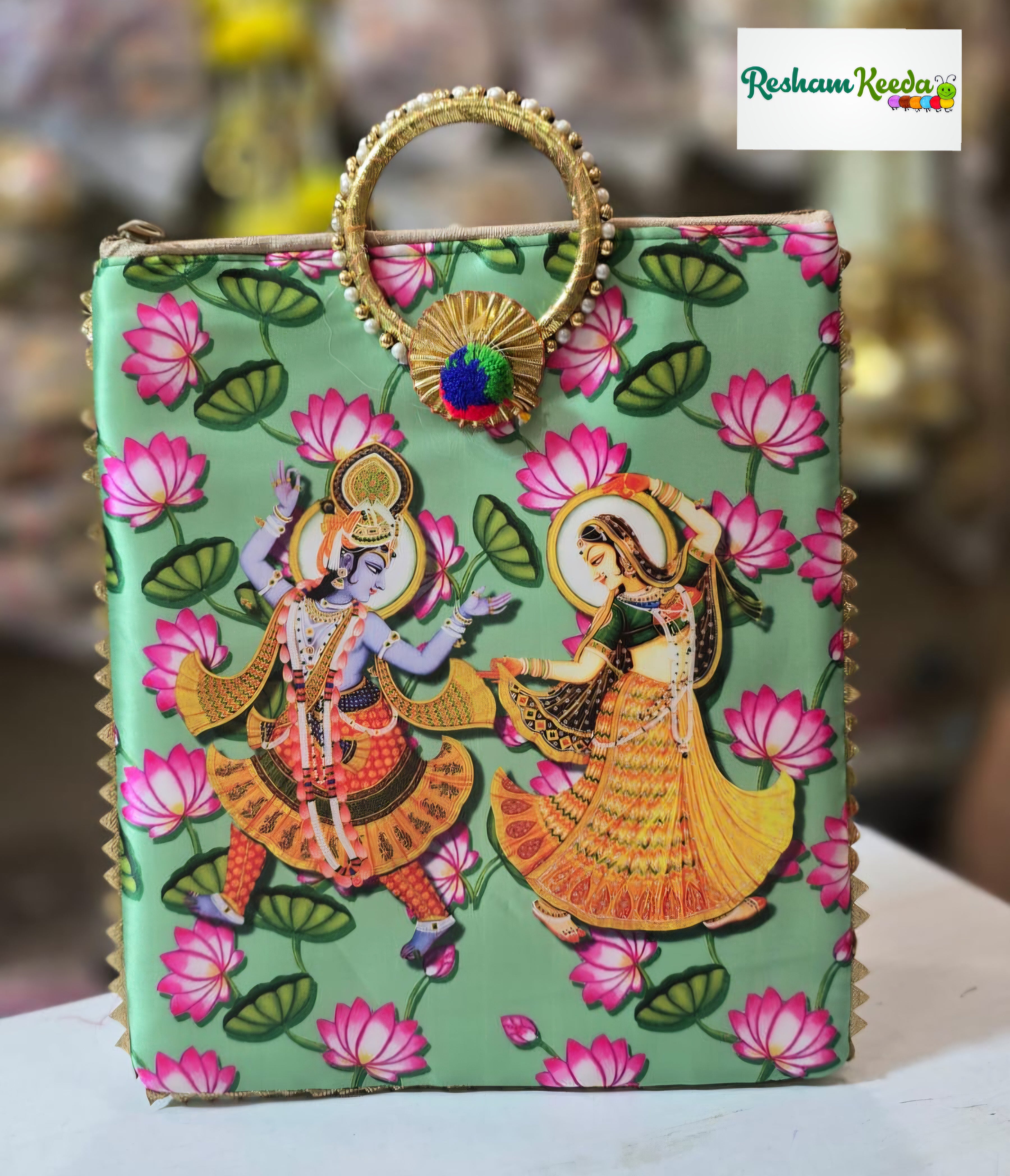 Budget Friendly Radha Krishna Pichwai Lotus Floral Digital Printed Purses Potli with Pearl Bangle Handle and Zipper Closure Perfect for Return Gift Favours Giveaways in Teej Parties Haldi Mehendi Diwali Festive and Wedding Events